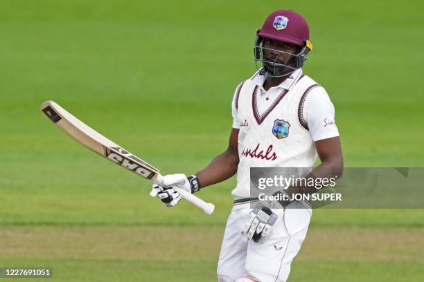 West Indies' Shamarh Brooks celebrates reaching 50 on the fourth day of the second Test cricket match between England and the West Indies at Old...