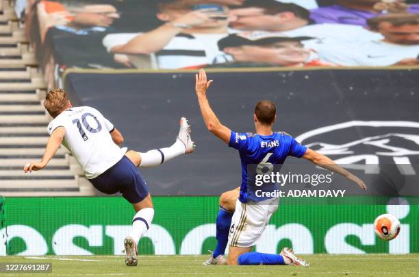 Tottenham Hotspur's English striker Harry Kane scores his team's third goal during the English Premier League football match between Tottenham...