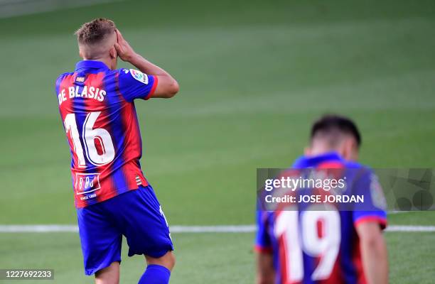 Eibar's Argentinian midfielder Pablo De Blasis reacts to missing a goal opportunity during the Spanish league football match between Villarreal CF...