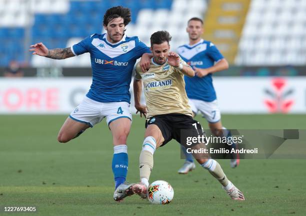 Marco D Alessandro of Spal is challenged by Sandro Tonali of Brescia Calcio during the Serie A match between Brescia Calcio and SPAL at Stadio Mario...