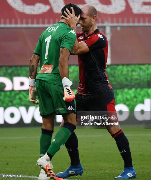 Andrea Masiello of Genoa CFC congratulates the goalkeeper Mattia Perin after his saved penalty during the Serie A match between Genoa CFC and US...