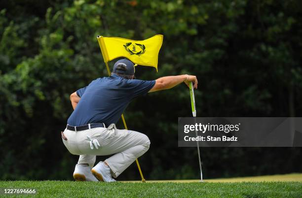 Ryan Palmer checks his putt on the second hole during the final round of the Memorial Tournament presented by Nationwide at Muirfield Village Golf...