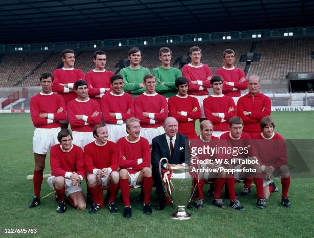 European Cup winners Manchester United line up for a team photograph with the trophy at Old Trafford on July 25, 1968 in Manchester, England. Back...