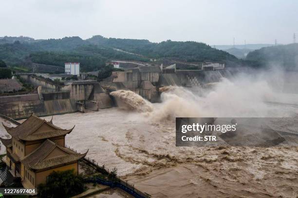 This aerial photo taken on July 19, 2020 shows water released from the Xiaolangdi Reservoir Dam in Luoyang in China's central Henan province, in...