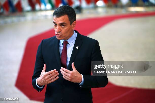 Spain's Prime Minister Pedro Sanchez makes a statement as he arrives for the fourth day of an EU summit at the European Council building in Brussels,...