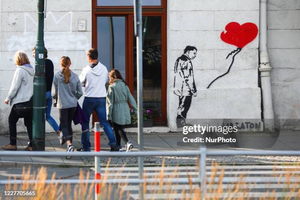 Inspired by Banksy's famous work 'Girl With Balloon', graffiti by Le Raton street artist, depicturing Jaroslaw Kaczynski, the leader of Law and...