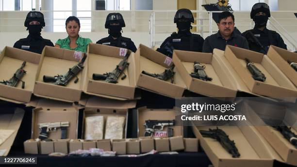 Members of drug gang "Los Zetas" Margarito Mendoza and Carmen Zuniga are shown to the press in Mexico City on October 22, 2010. During their arrest,...