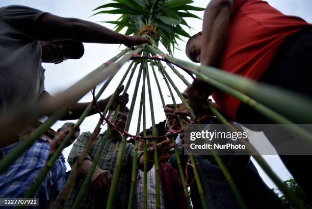 Nepalese devotees making straw effigy demon Ghantakarna during the Gathemangal festival celebrated at Bhaktapur, Nepal on Sunday, July 19, 2020....