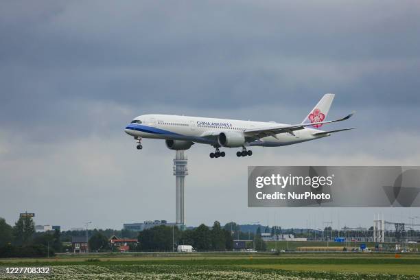 China Airlines Airbus A350-900 aircraft as seen on final approach flying, landing and touching down at Amsterdam Schiphol AMS EHAM International...