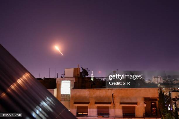 Syrian Air defences respond to Israeli missiles targeting south of the capital Damascus, on July 20, 2020. - Israeli strikes south of the Syrian...