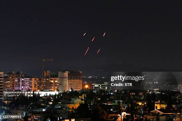 Syrian Air defences respond to Israeli missiles targeting south of the capital Damascus, on July 20, 2020. - Israeli strikes south of the Syrian...