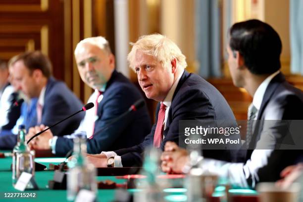 Prime Minister Boris Johnson chairs a face-to-face meeting of his cabinet team of ministers, the first since mid-March, at the Foreign and...