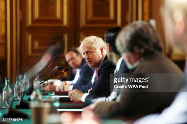 Prime Minister Boris Johnson chairs a face-to-face meeting of his cabinet team of ministers, the first since mid-March, on July 21, 2020 in London,...