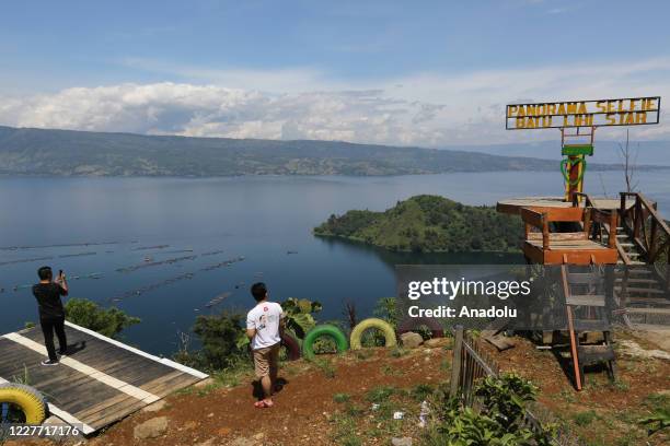People visit Lake Toba in Parapat, Simalungun District, North Sumatra, Indonesia on July 21, 2020. Lake Toba has become one of the super priority...