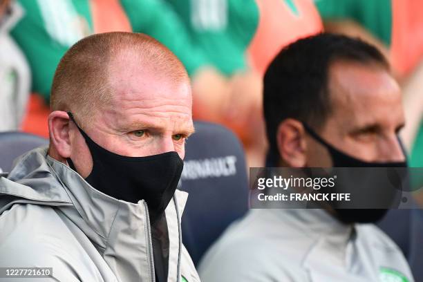 Celtic FC's Irish head coach Neil Lennon , wearing a protective face mask, looks on during the friendly football match Paris Saint-Germain vs Glasgow...