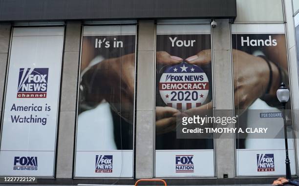 Political display is posted on the outside of the Fox News headquarters on 6th Avenue in New York July 21, 2020. A female former producer at Fox News...