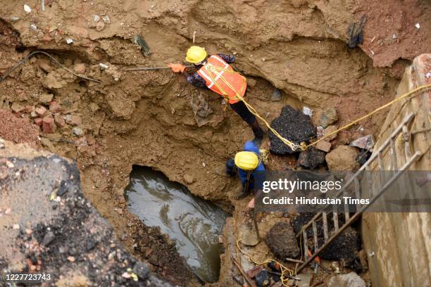 Restoration work underway on National Highway-48 after the road cave-in due to heavy rain, at IFFCO chowk on July 21, 2020 in Gurugram, India.