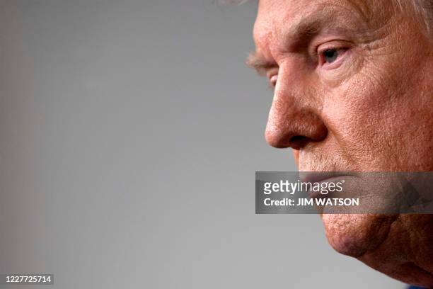 President Donald Trump looks on during the renewed briefing of the Coronavirus Task Force in the Brady Briefing Room of the White House on July 21 in...