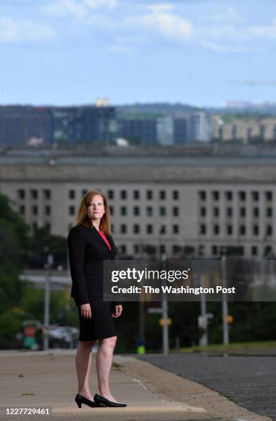 Retired U.S. Army Colonel Kathy Spletstoser poses for a portrait as the Pentagon is seen in the background on Wednesday May 27, 2020 in Arlington,...