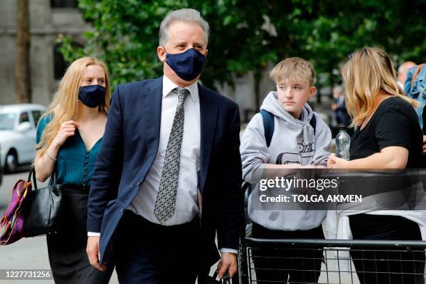 Former UK intelligence officer Christopher Steele arrives at the High Court in London on July 22 to attend his defamation trial brought by Russian...