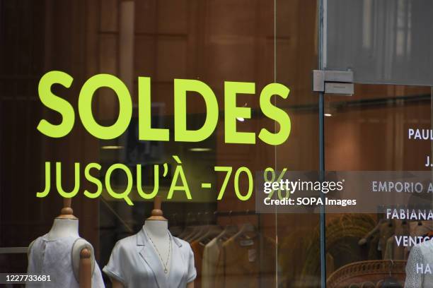 Sale sign on a store window. Summer sales in France which normally start at the end of June were delayed until July 15th due to coronavirus crisis....