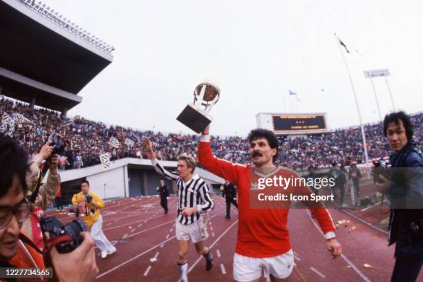 Massimo BONINI and Luciano FAVERO of Juventus with the jersey of Argentinos celebrate the victory with the trophy during the Intercontinental Cup,...