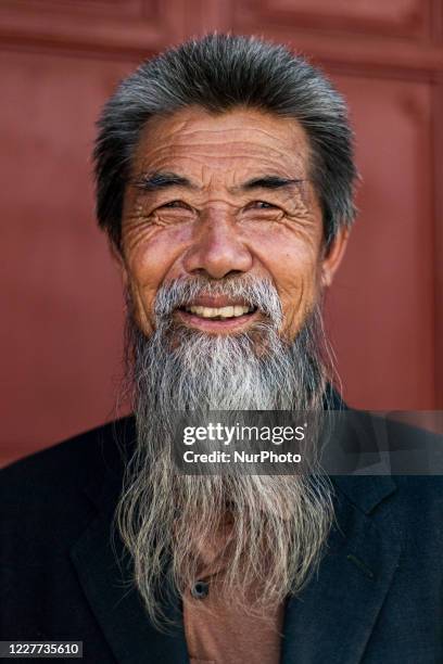 Dali, China, the 28 August 2011. Portrait of a man in the Shuanglang Zhen village in the Yunnan province. Dali, Chine, le 28 aout 2011. Le portrait...