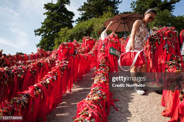 Xi'an, China, the 30 June 2011. A woman comes to pray on the mount Hua. It is a mountain located near the city of Huayin in Shaanxi province, about...