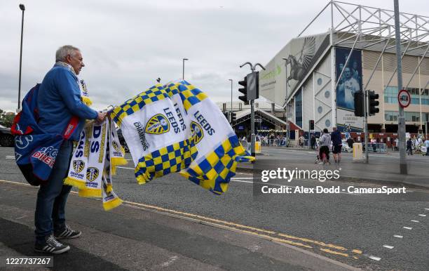 Traders sell celebratory scarves, flags and other merchandise outside Elland Road during the Sky Bet Championship match between Leeds United and...