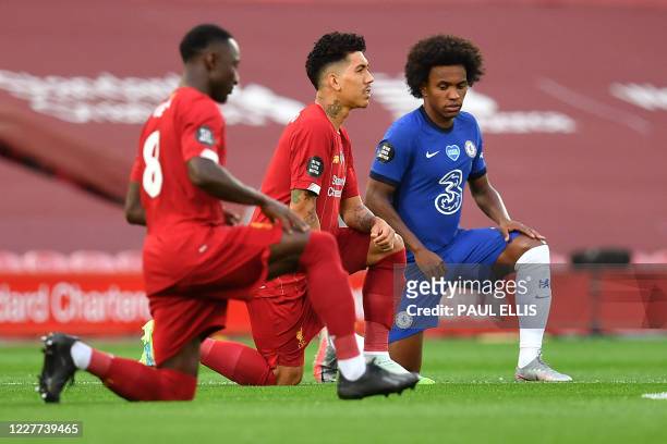 Liverpool's Guinean midfielder Naby Keita Liverpool's Brazilian midfielder Roberto Firmino and Chelsea's Brazilian midfielder Willian 'take a knee'...