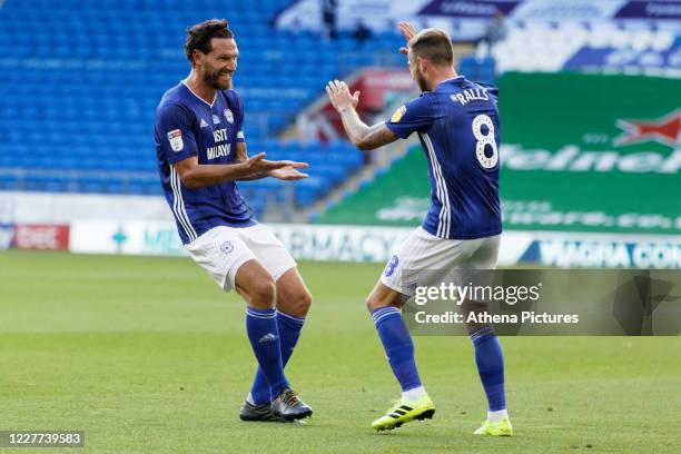 Sean Morrison of Cardiff City celebrates his goal with team mate Joe Ralls during the Sky Bet Championship match between Cardiff City and Hull City...