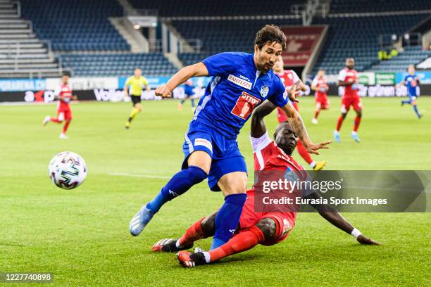 Ryder Matos of Luzern is challenged by Birama Ndoye of FC Sion during the Swiss Raiffeisen Super League match between FC Luzern and FC Sion at...