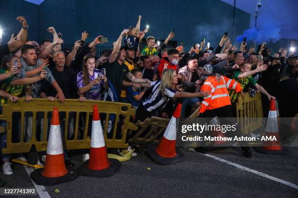 Fans of West Bromwich Albion celebrate outside the stadium as promotion is confirmed to the Premier League on the final day during the Sky Bet...