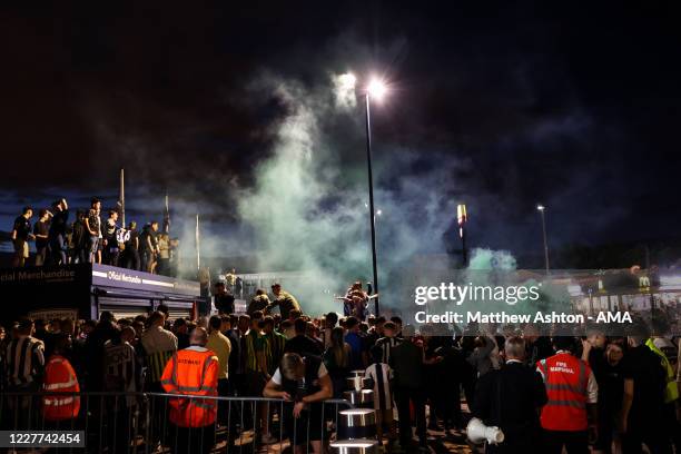 Fans of West Bromwich Albion celebrate outside the stadium as promotion to the Premier League is confirmed during the Sky Bet Championship match...