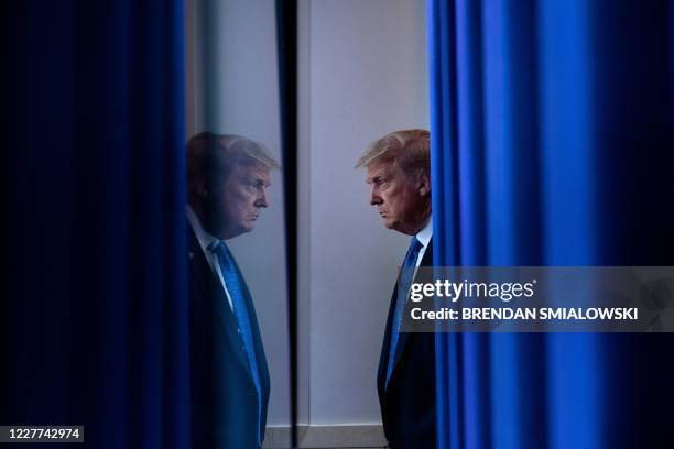 President Donald Trump arrives to speak to the press ahead of the renewed briefing of the Coronavirus Task Force in the Brady Briefing Room of the...