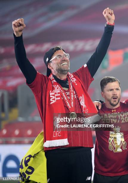 Liverpool's German manager Jurgen Klopp celebrates during the Premier League trophy presentation following the English Premier League football match...