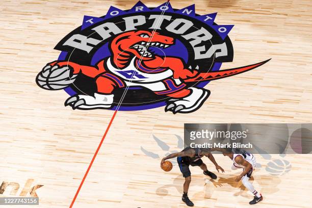 Kawhi Leonard of the LA Clippers handles the ball during the game while Norman Powell of the Toronto Raptors plays defense during the game on...