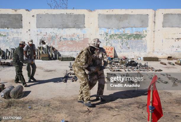 Teams affiliated to the Libyan Military Engineering Directorate carry 10 tons of ammunition cleared from civilian settlements, to neutralize remotely...
