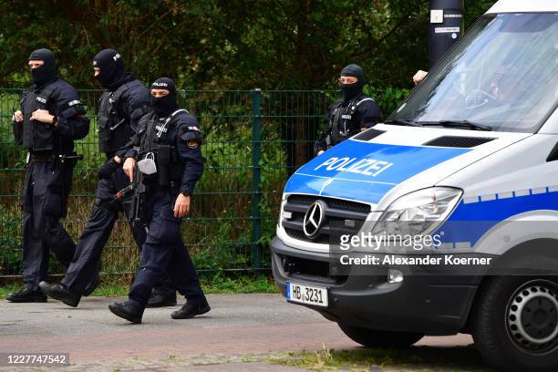 Heavily armed police forces, equipped with Heckler & Koch MP5 machine gun, secure the funeral of Hells Angels motorcycle member Rainer Kopperschmidt...