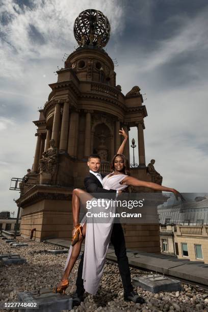 Oti Mabuse and husband Marius Lepure pose on the roof of the London Coliseum on July 23, 2020 in London, England. Oti Mabuse and husband Marius...