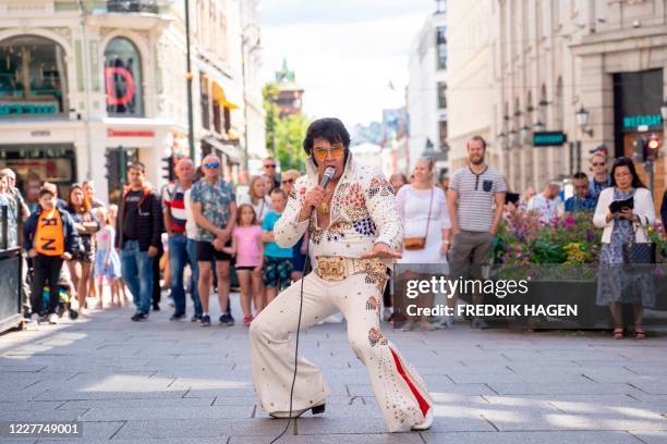 Norwegian artist Kjell Elvis performs in central Oslo in an attempt to beat the record of the world´s longest Elvis Presley singing marathon on July...