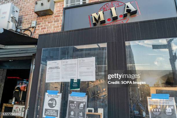 Suspension of License Order pinned on a window of M.I.A Restaurant Lounge in Astoria after the State Liquor authority suspended its liquor license...