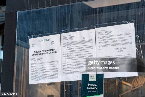 Suspension of License Order pinned on a window of M.I.A Restaurant Lounge in Astoria after the State Liquor authority suspended its liquor license...
