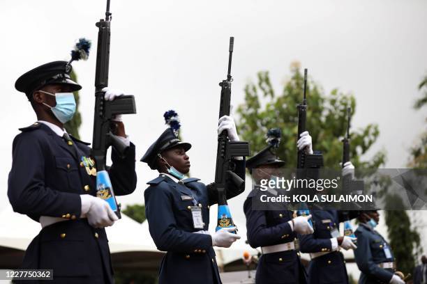 Colleagues of Tolulope Arotile, Nigerias first female combat helicopter pilot, who was killed in an accident, prepares to fire a 21-gunshot salute...