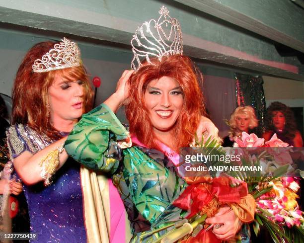 Female impersonator Joel Thomson portraying "Desiray" adjusts his crown during the beauty queen competition of the Miss Fantasy Fest late 24 October...
