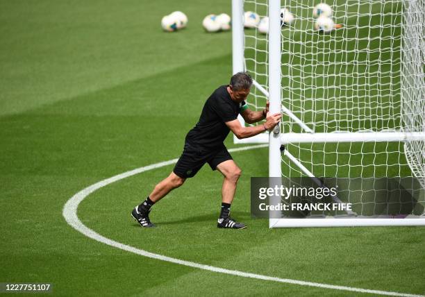 Saint-Etienne's French head coach Claude Puel takes part in a training session at the Stade de France stadium, in Saint-Denis, on the outskirts of...