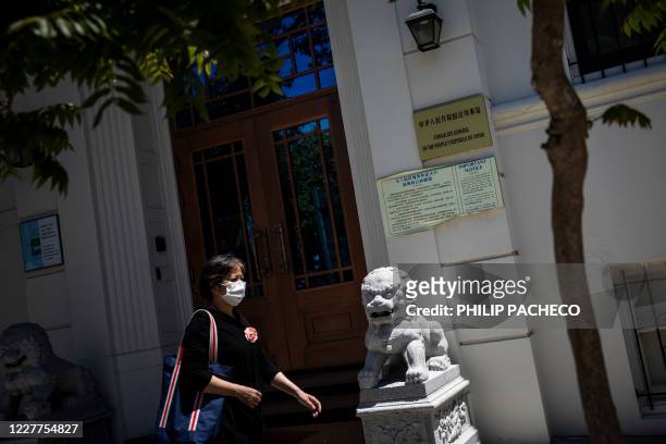 Person walks past the Consulate General of the People's Republic of China in San Francisco, California on July 23, 2020. - The US Justice Department...