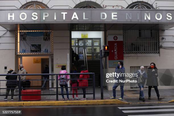 People attend outside hospital in Buenos Aires, Argentina, on July 23, 2020. In the last days the cases of COVID-19 increased significantly. Door of...