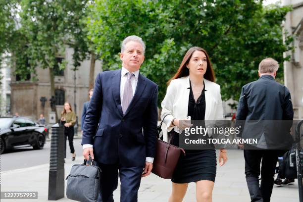 Former UK intelligence officer Christopher Steele arrives at the High Court in London on July 24 to attend his defamation trial brought by Russian...