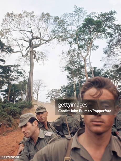 Portuguese soldiers, volunteers who sign up for a year at a time, fighting against African nationalists in Angola, circa July 1964. The John Bulmer...